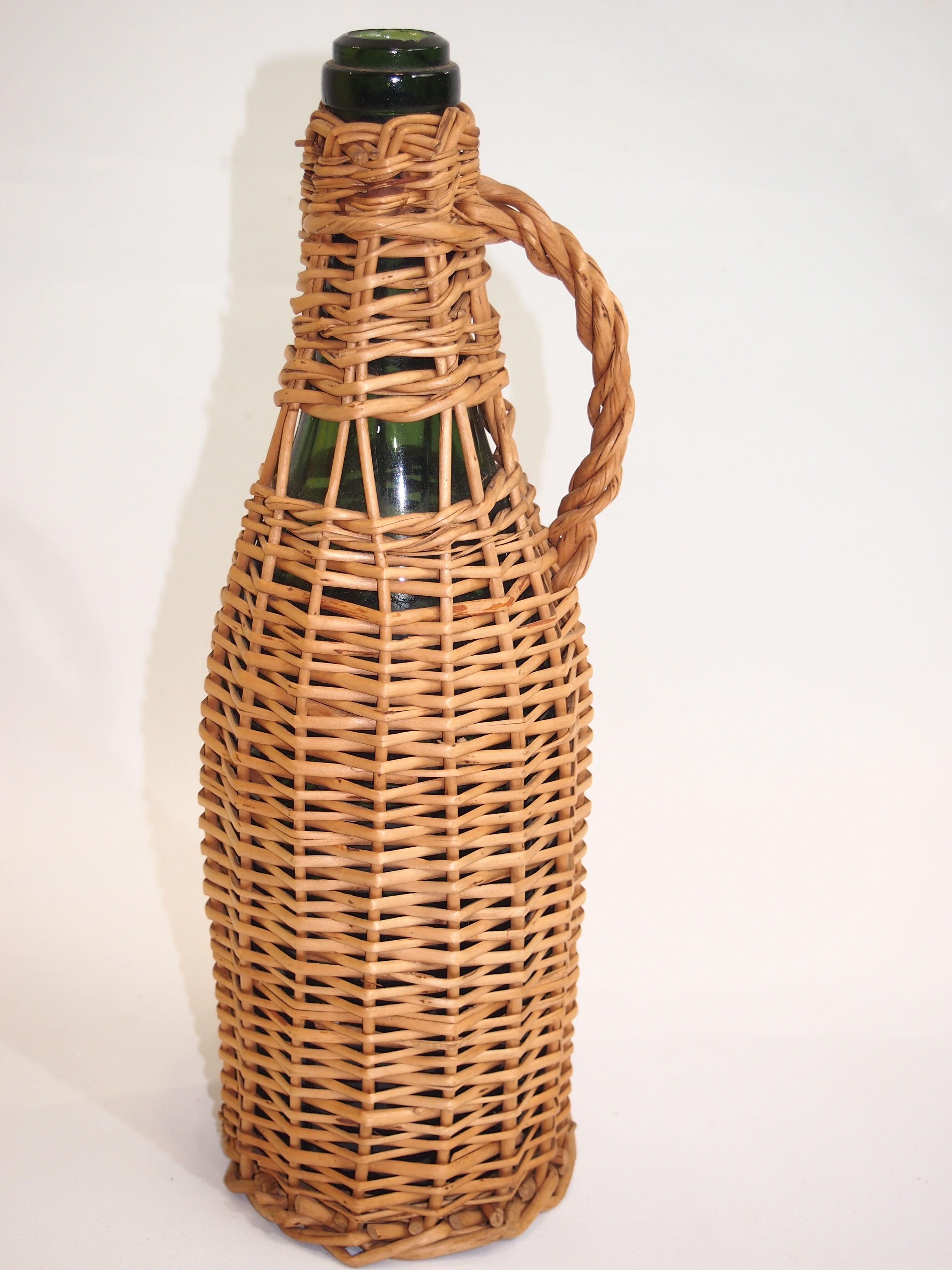 Bottle dressed in rattan