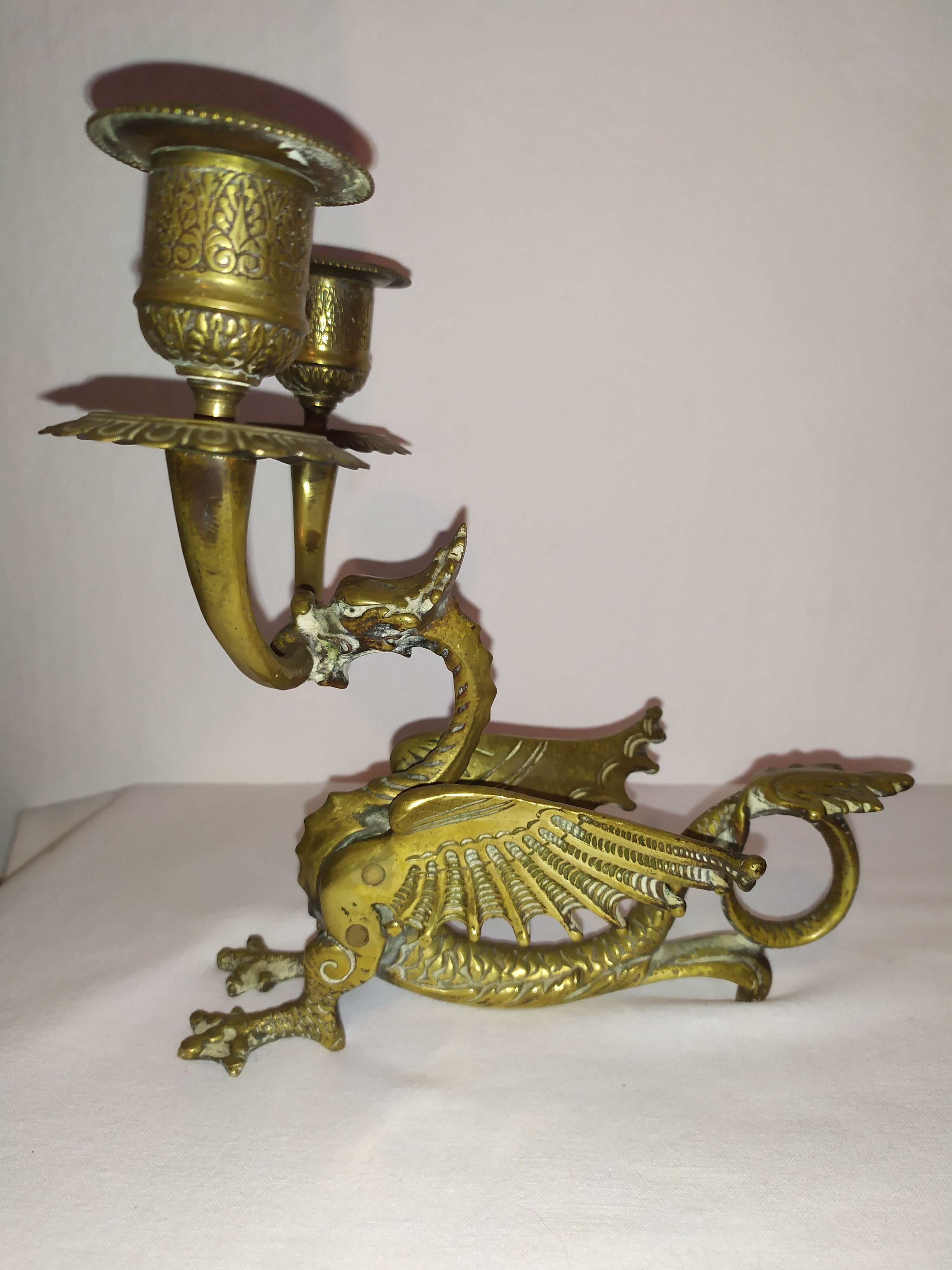 Pair of candlesticks with old chimera dragons hands