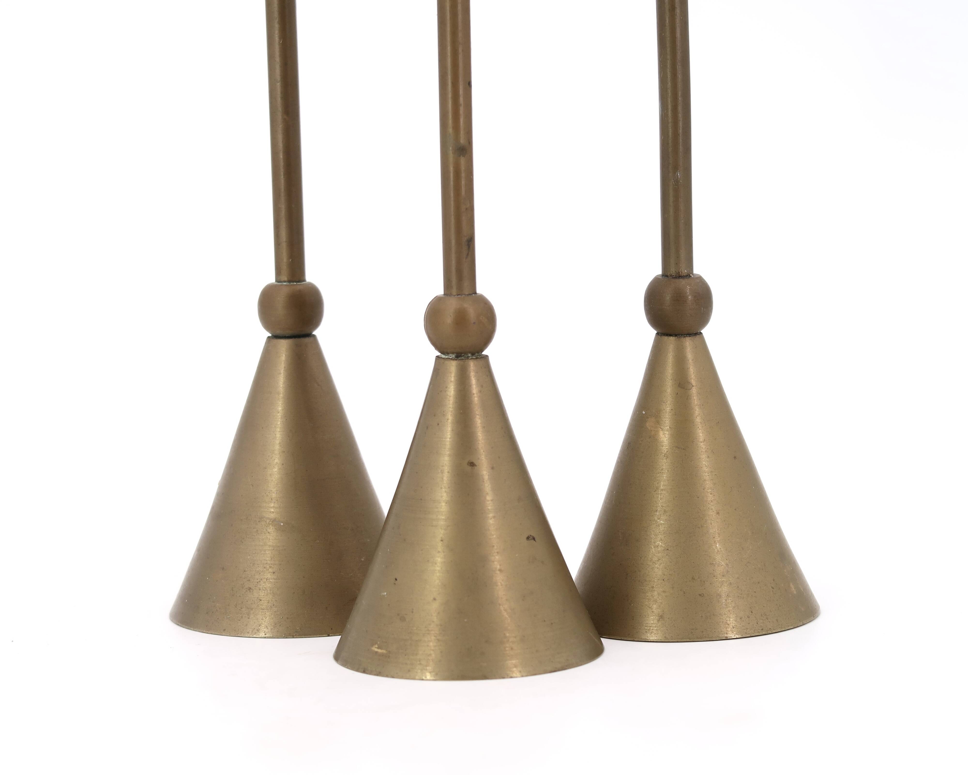 Trio of brass candlesticks, 1970s