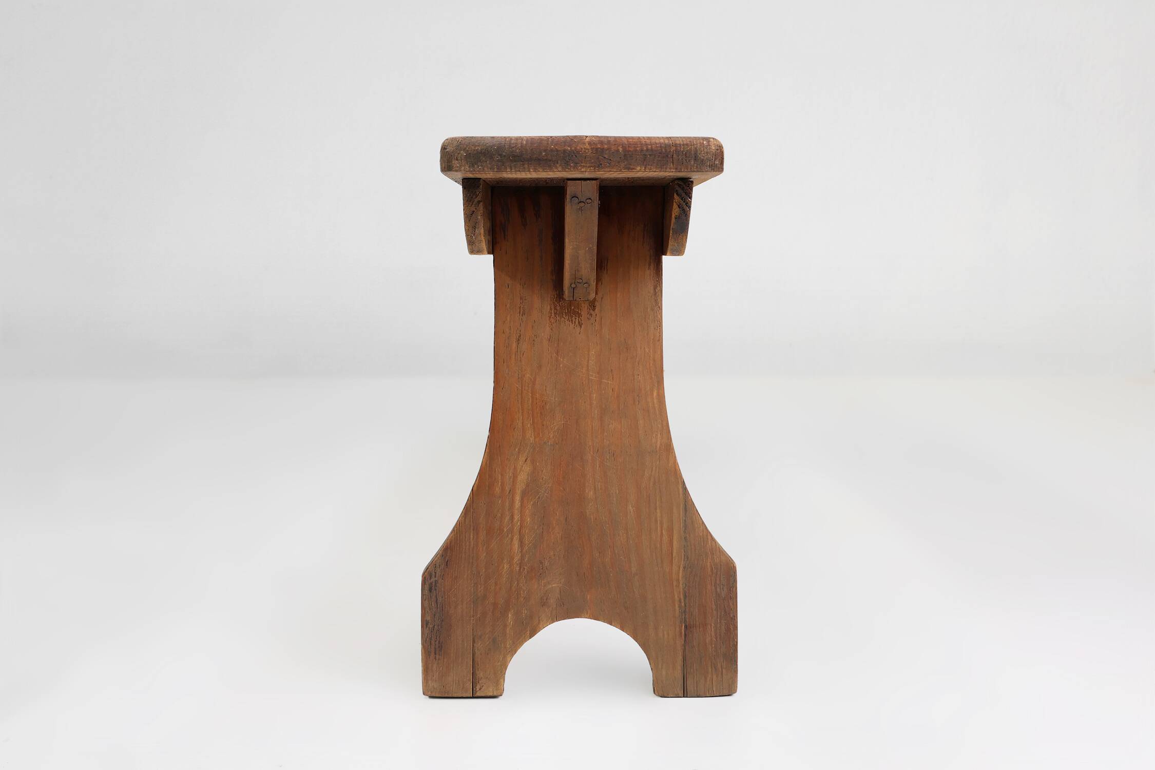 Rustic natural oak wooden bench with rounded details, France ca. 1900