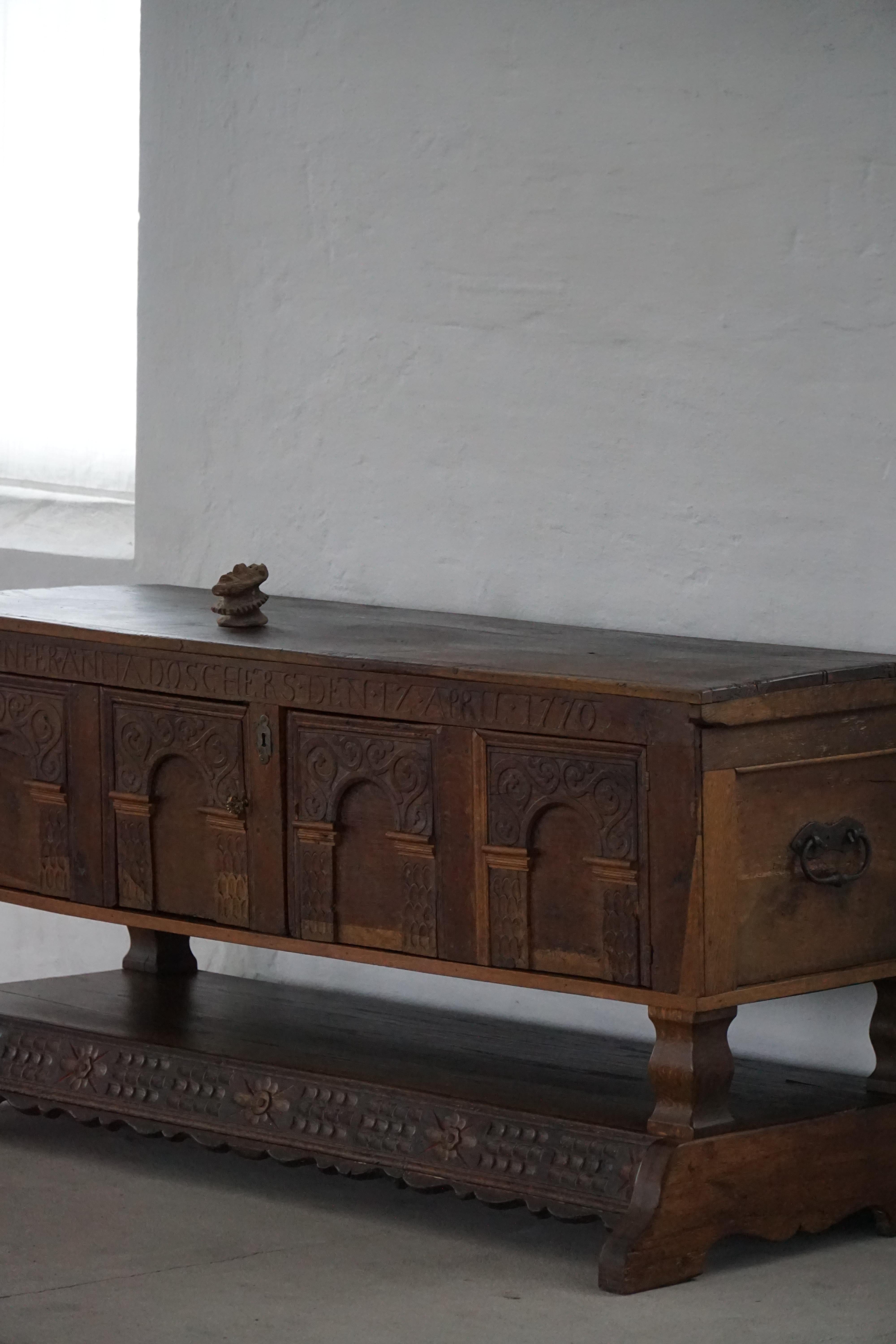 Danish baroque oak buffet from the early 18th century, carved details, 1700-1750.