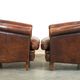 Set of two rugged sheep let of two rugged sheep leather club armchairs with a nice distressed look