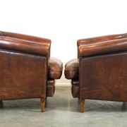 Set of two rugged sheep let of two rugged sheep leather club armchairs with a nice distressed look