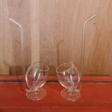 Pair of glasses with integrated straw