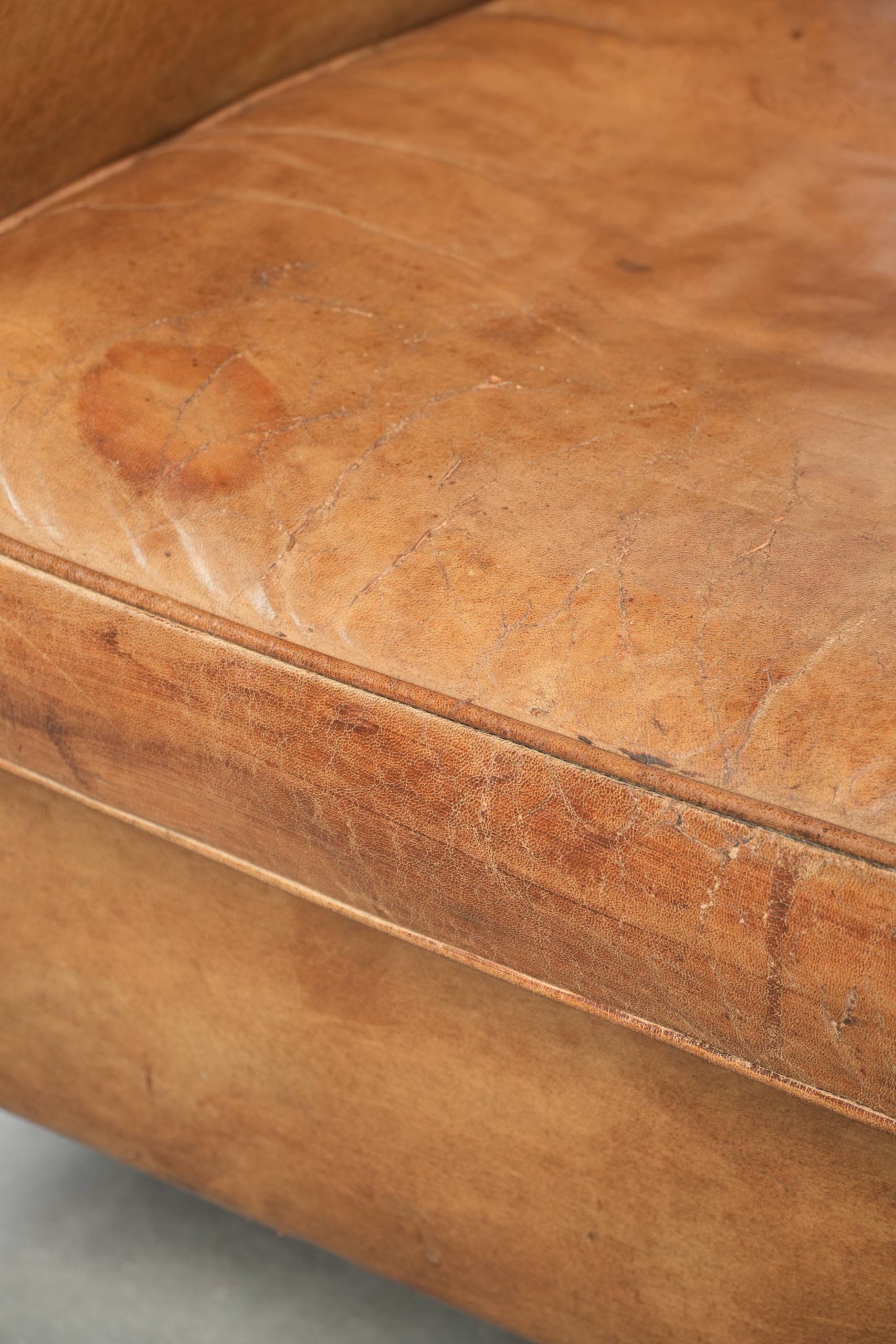 Vintage sheepskin club armchair finished with decorative nails