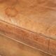 Vintage sheepskin club armchair finished with decorative nails