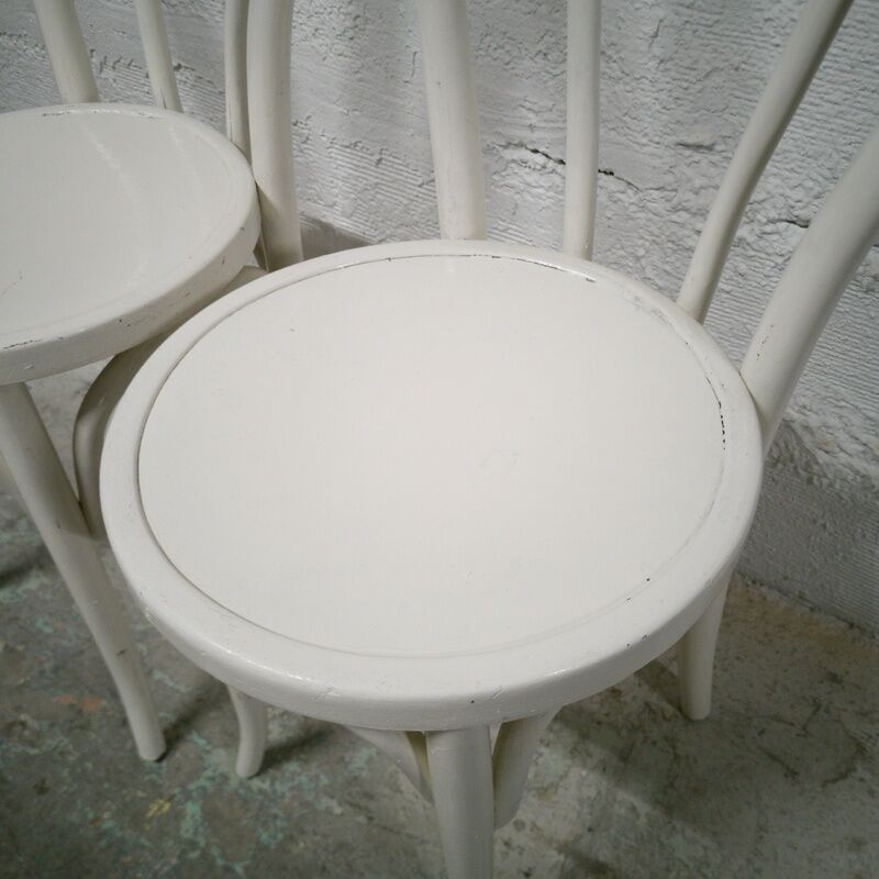 Pair of white Baumann bistro chairs