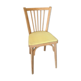 Wooden chair and yellow skai