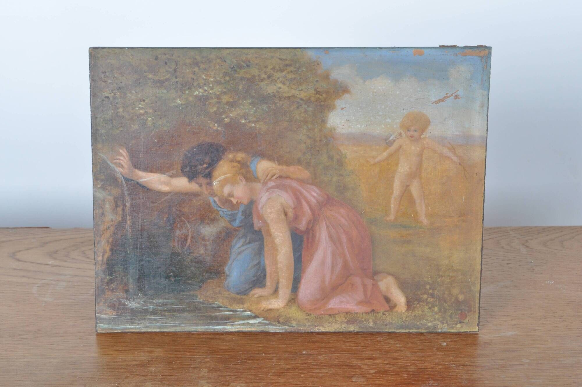 Painting on wood "Cupid and a couple at the fountain".