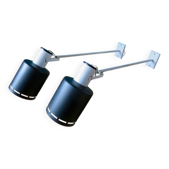 Pair of long white arm wall lights with black spot. "lita device"
