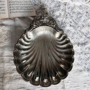 Large vintage shell-shaped platter in shiny silver-plated metal.