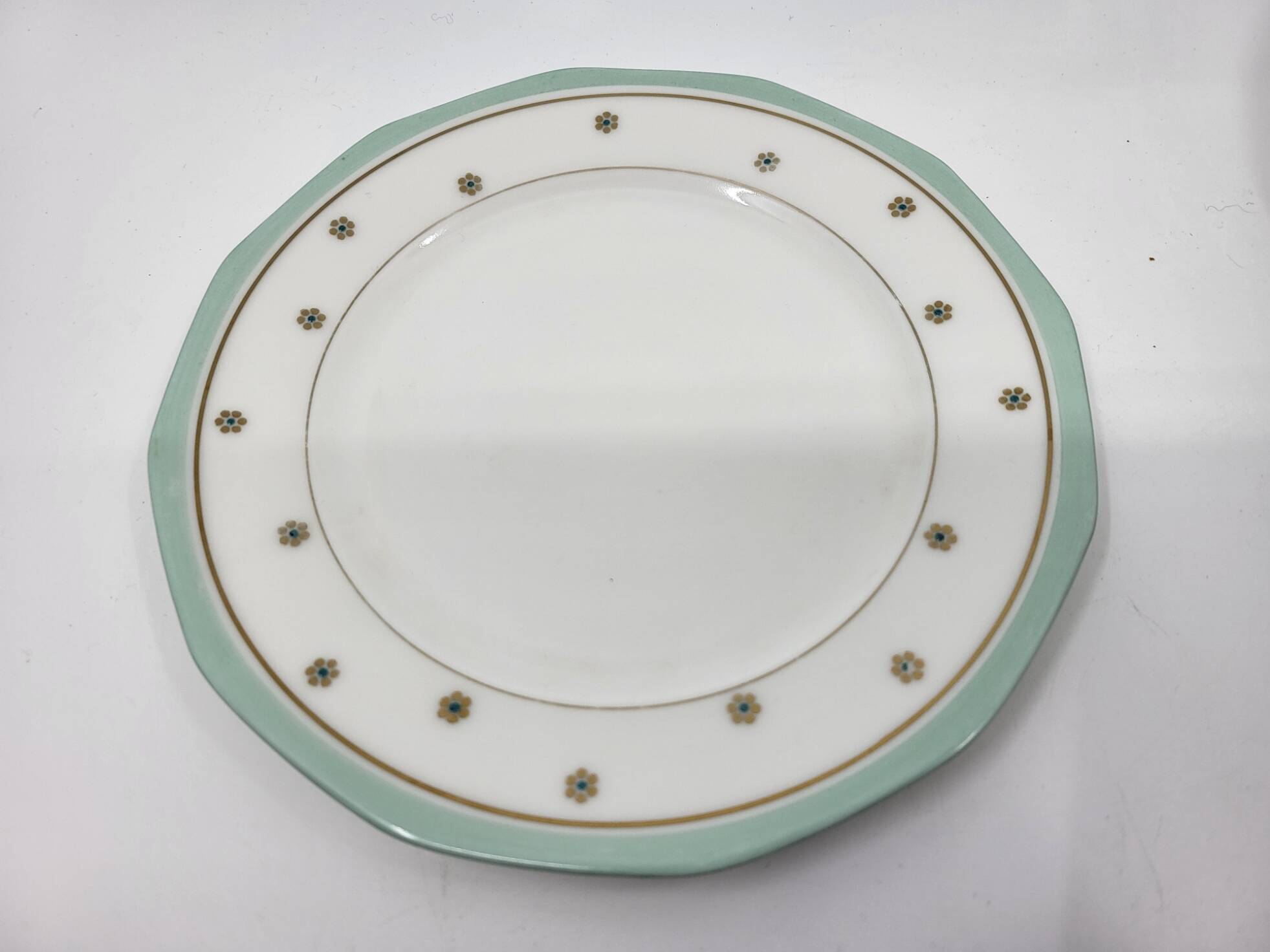 Limoges porcelain plates with green border and gold and blue flower decoration, French set of 8