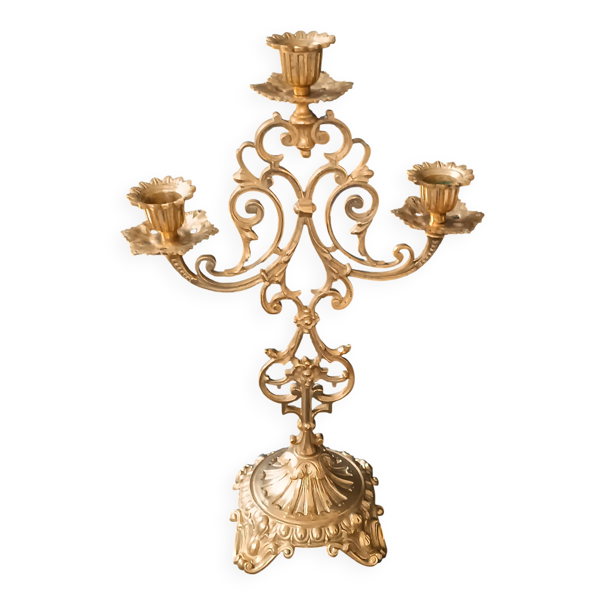 Antique three-light openwork brass church candelabrum.