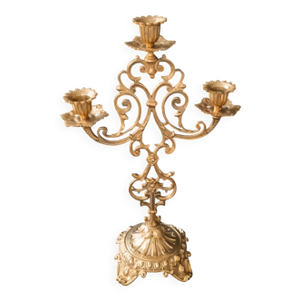 Antique three-light openwork brass church candelabrum.