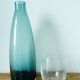 Designer vase in blue-green glass