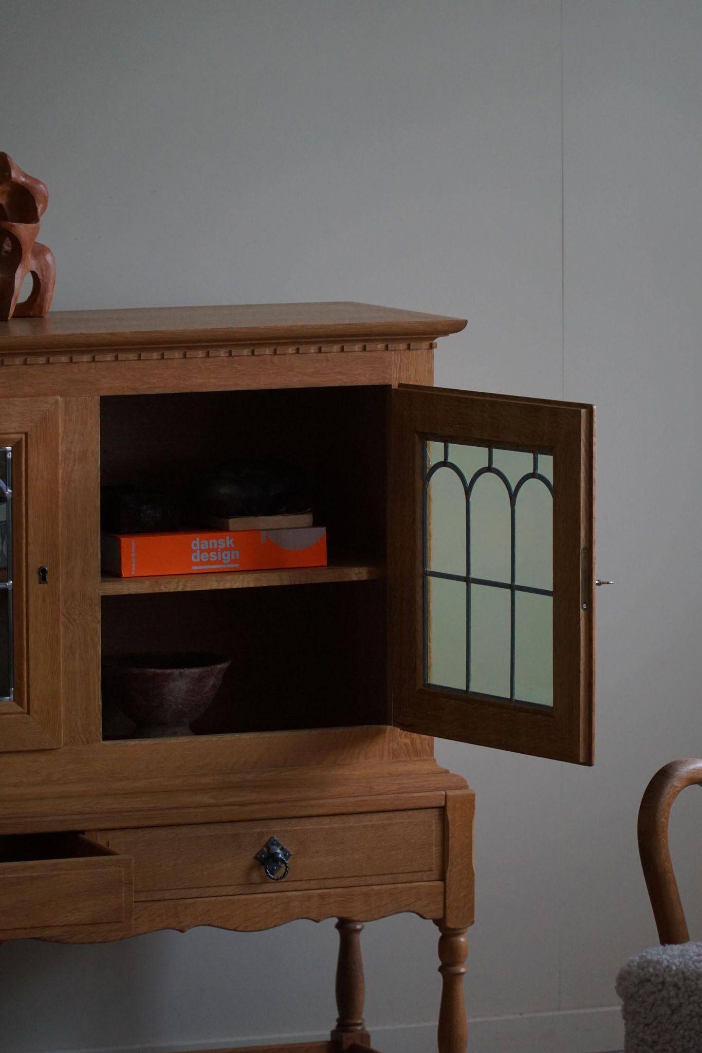 20th-century solid oak display cabinet with a glass front, by a Danish cabinetmaker.
