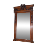 Bevelled mirror in carved wood