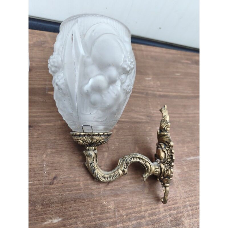 Pair of brass wall lights and glass paste.