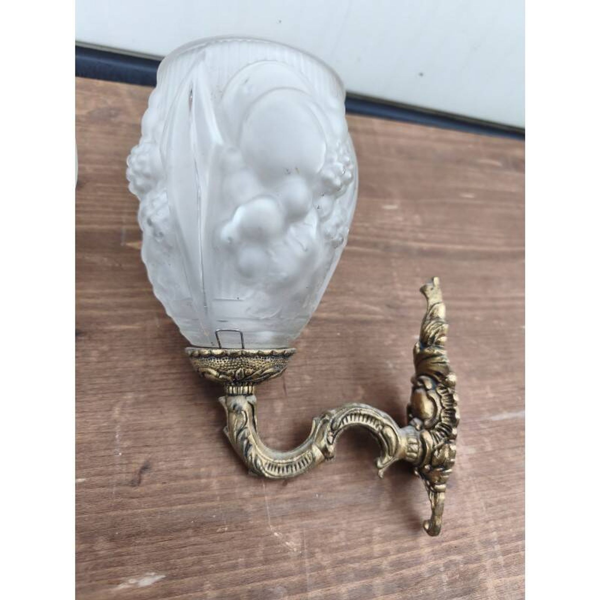 Pair of brass wall lights and glass paste.