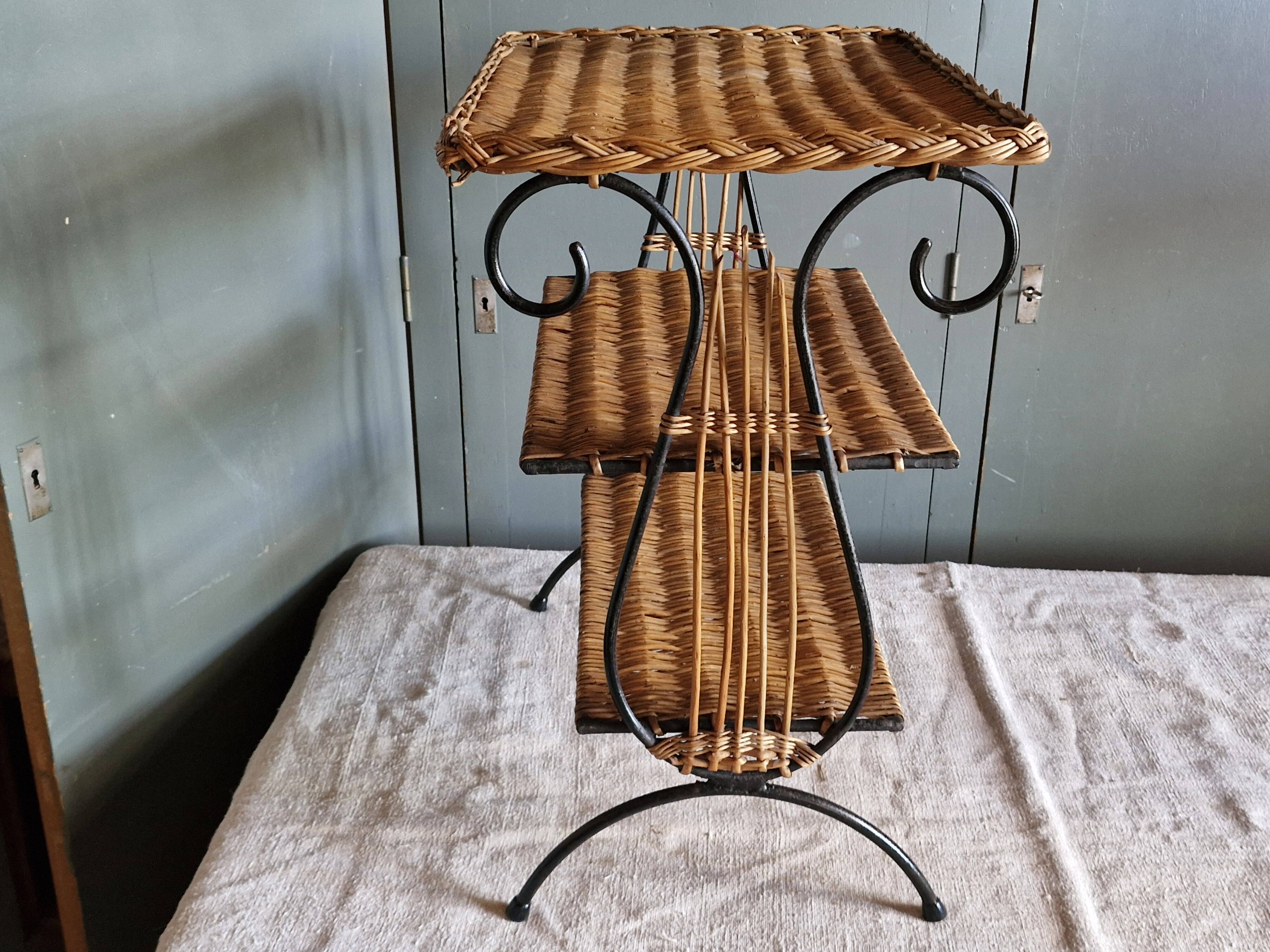Small antique piece of furniture from the 1960s made of rattan and wrought iron in the shape of a lyre.