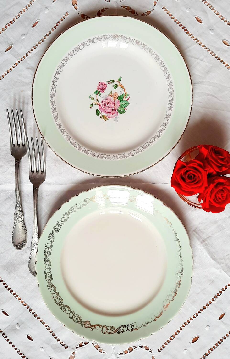 Old mismatched earthenware dinner plates accompanied by a deep dish