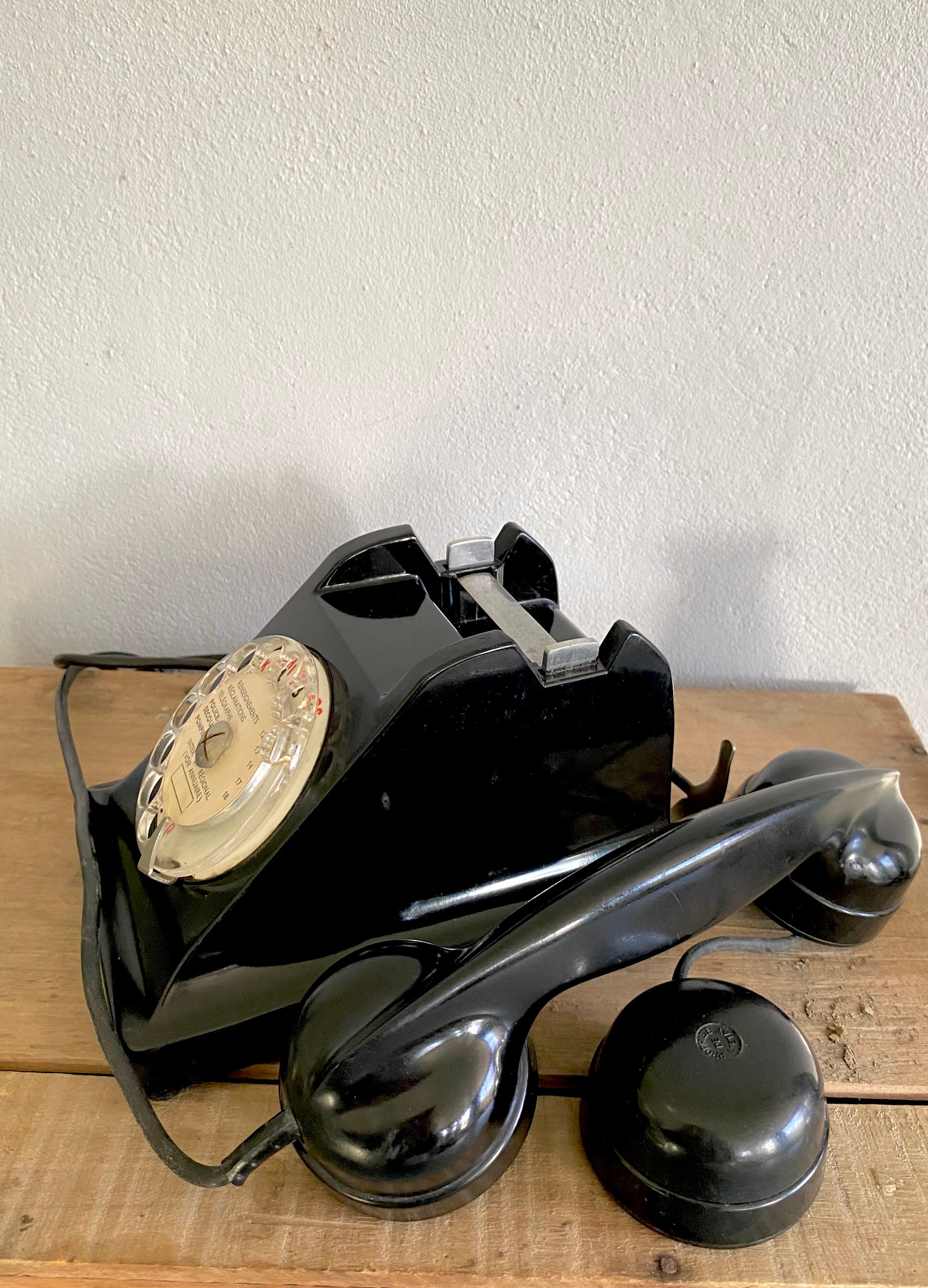 Black Bakelite phone with earphone