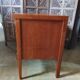 Vintage storage unit with two doors and four drawers.
