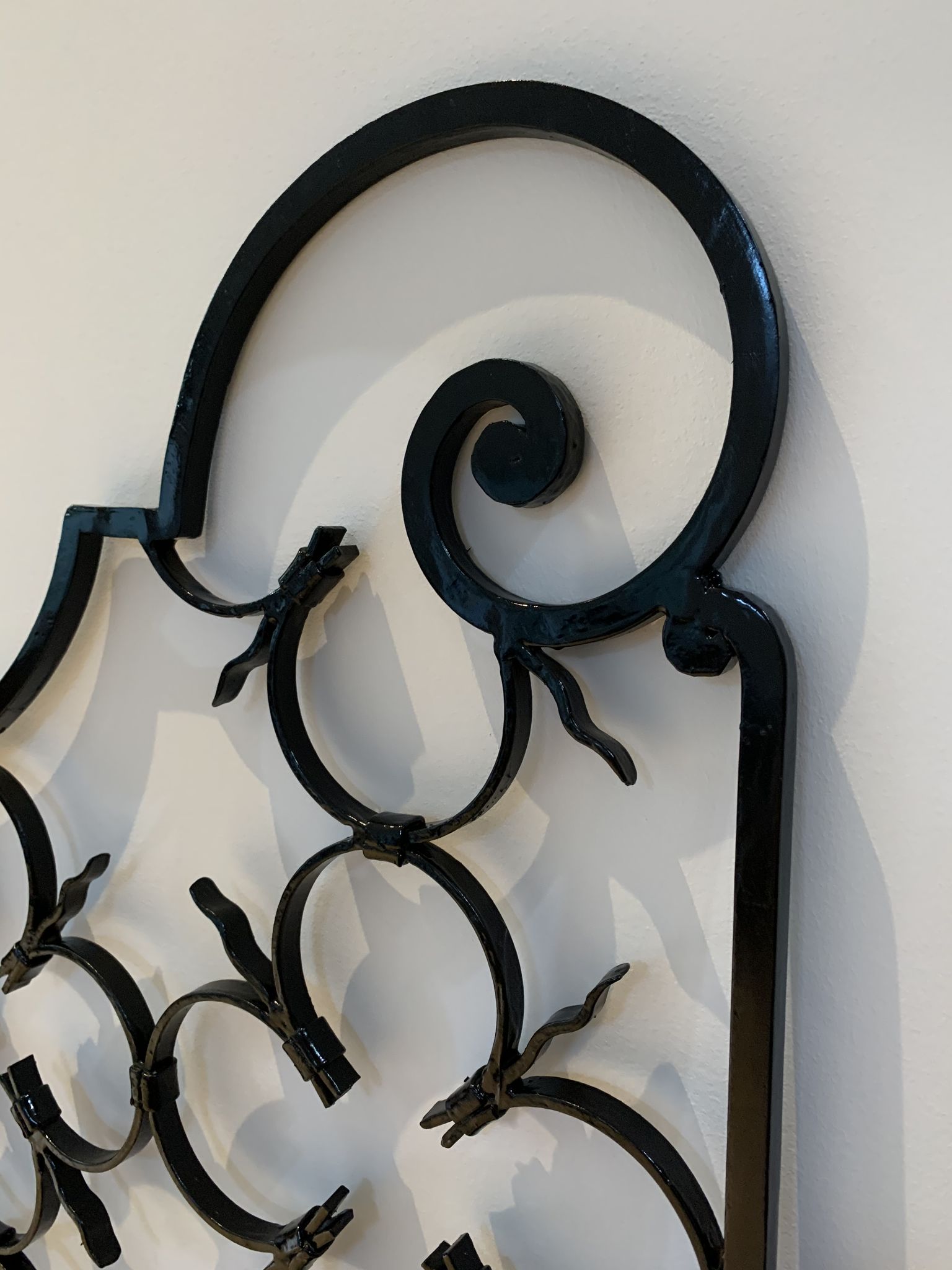Ancient pair of door opening gates has hell volutes forged craftsmanship