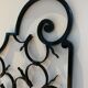 Ancient pair of door opening gates has hell volutes forged craftsmanship