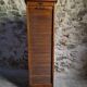 French antique wardrobe with curtain in oak, circa 1920–1930.