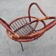 Rattan shell armchair with metal feet