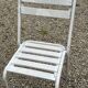 Garden furniture in wrought iron and wooden slats composed of two armchairs, 4 chairs and a table.