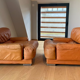 Paire de fauteuils vintage Gérard Guermonprez cuir fauve et inox, France 1970