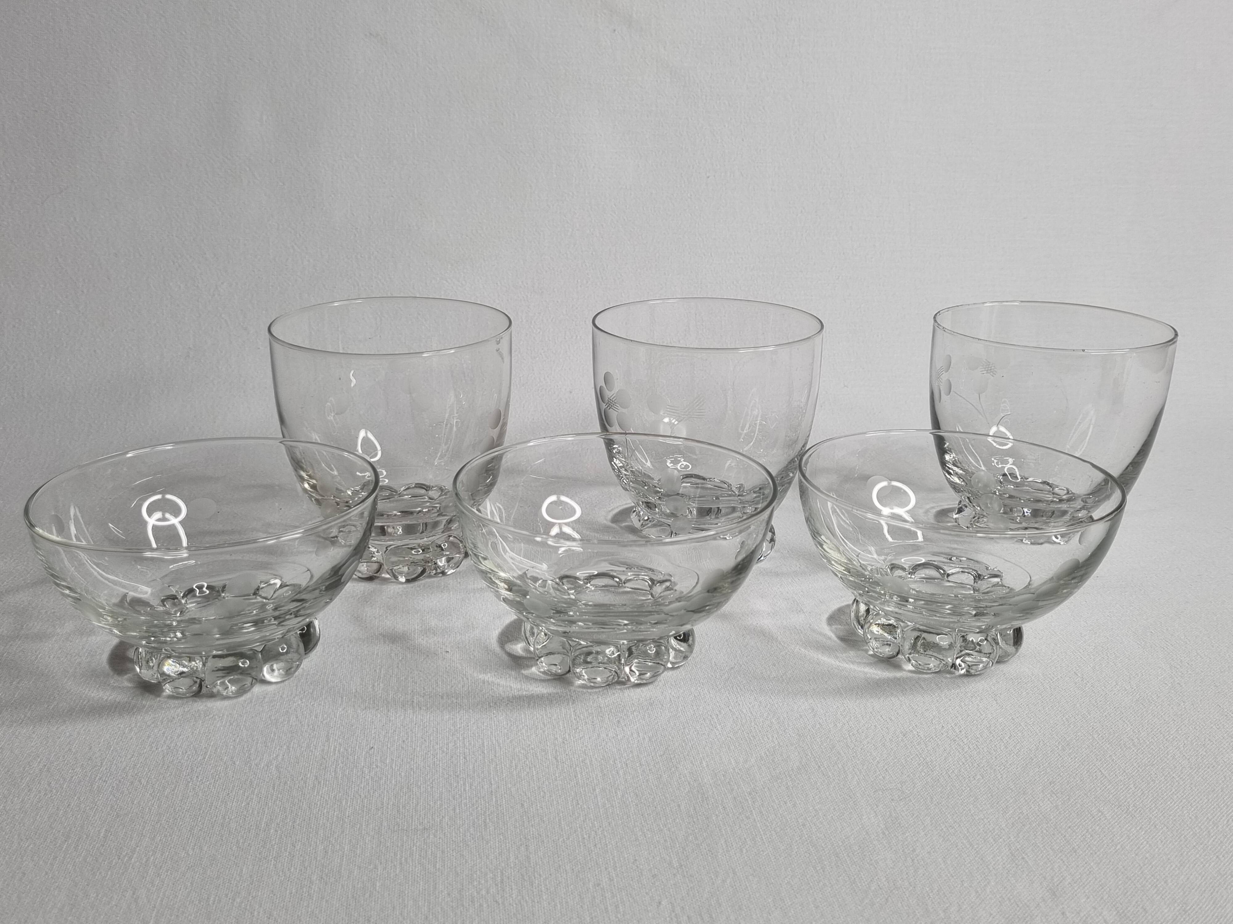Set of Art Deco style engraved crystal bowls and glasses on spherical feet