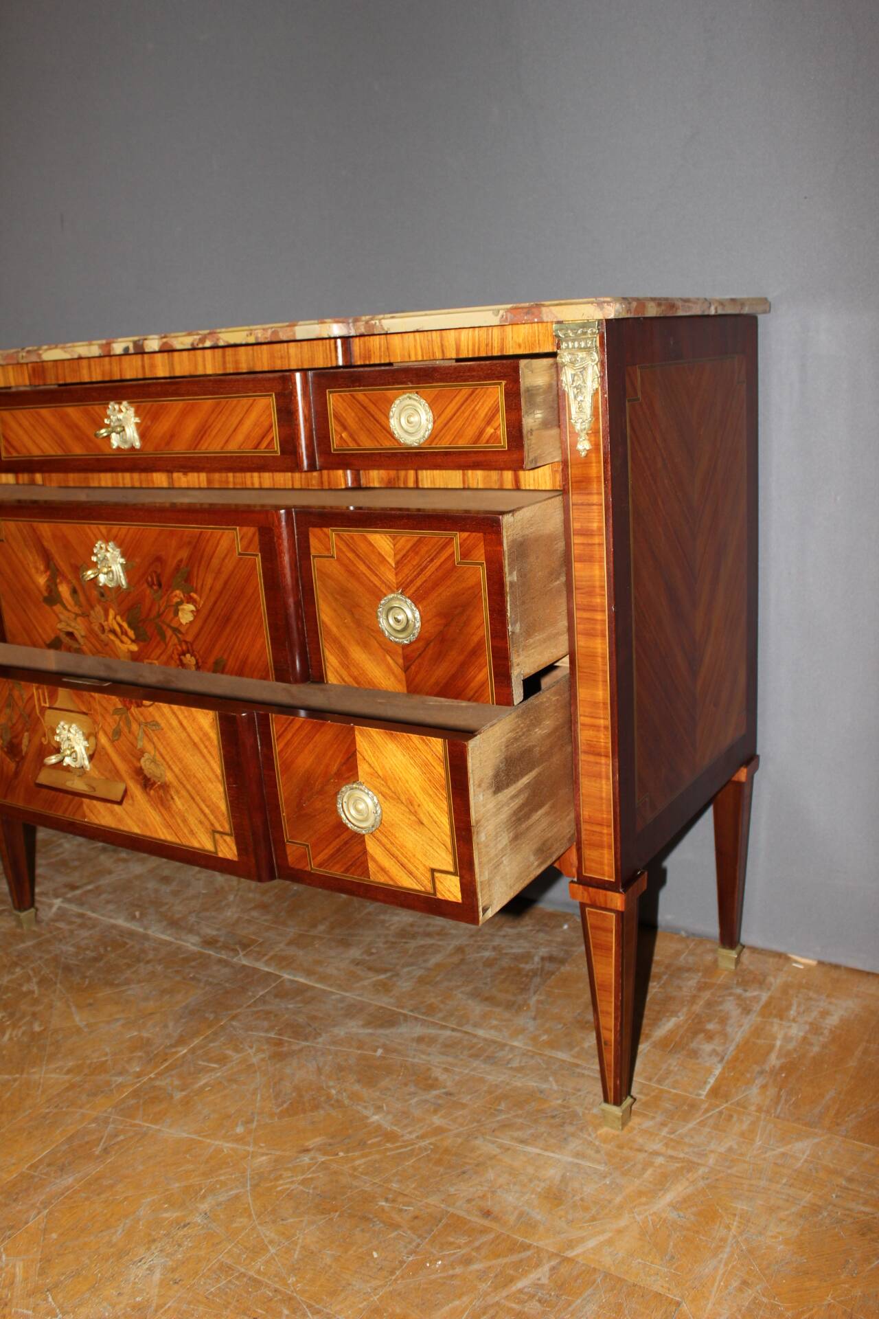 Louis XVI style commode in marquetry from around 1940.