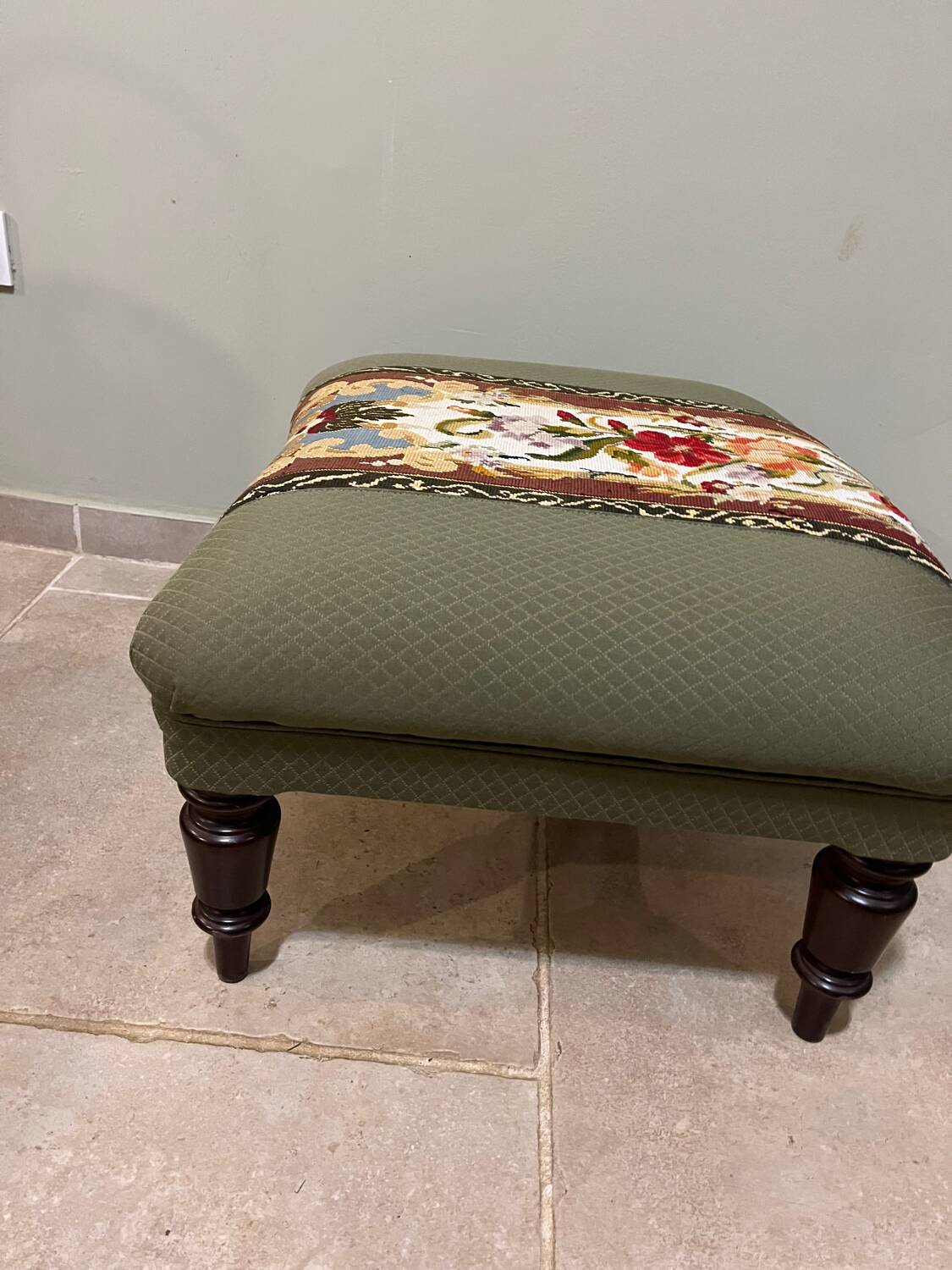 Vintage upholstered footstool, floral decor in Aubusson style.