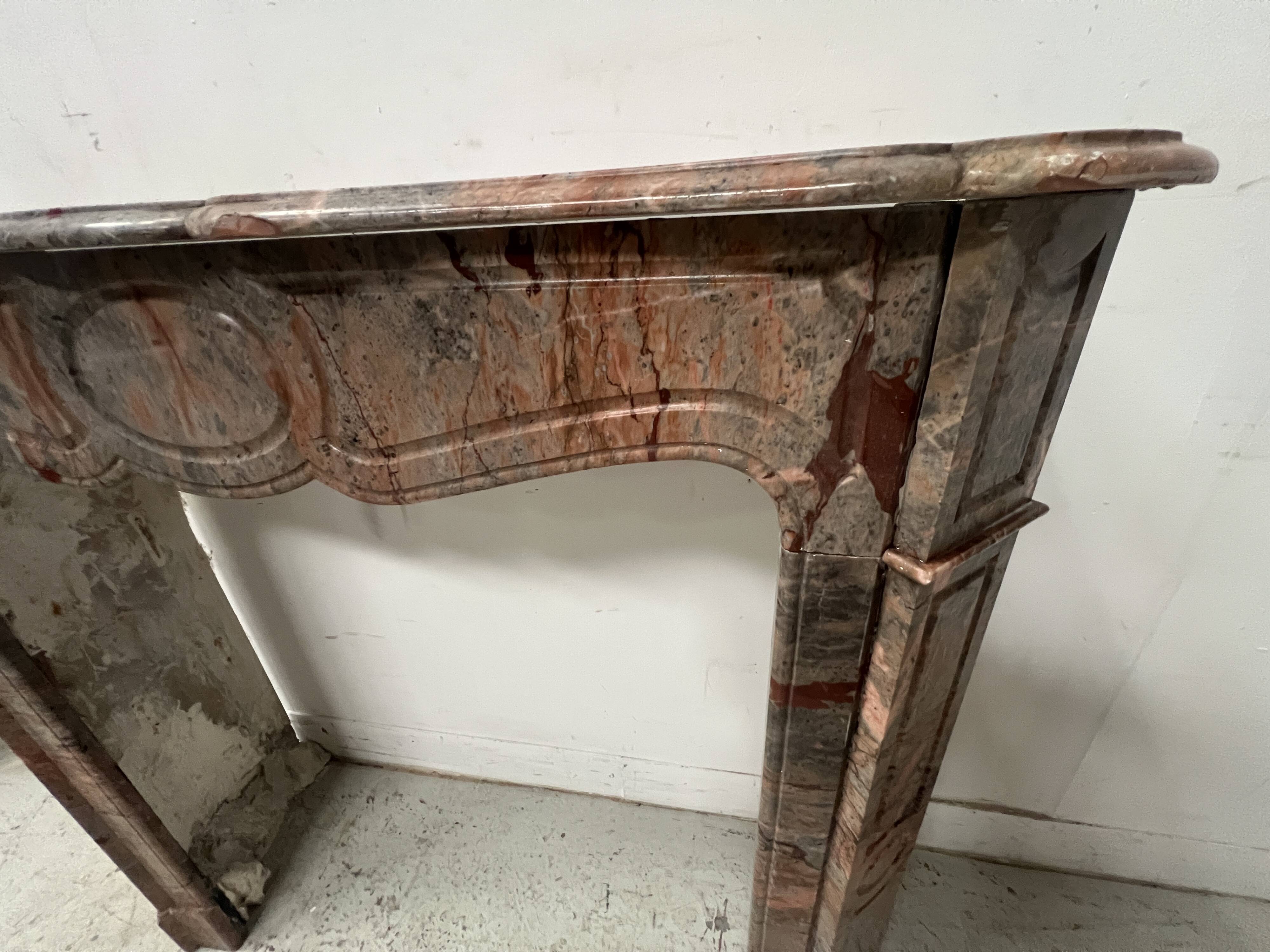 Louis XV style fireplace, "Pompadour" model, grey-pink marble, 20th century