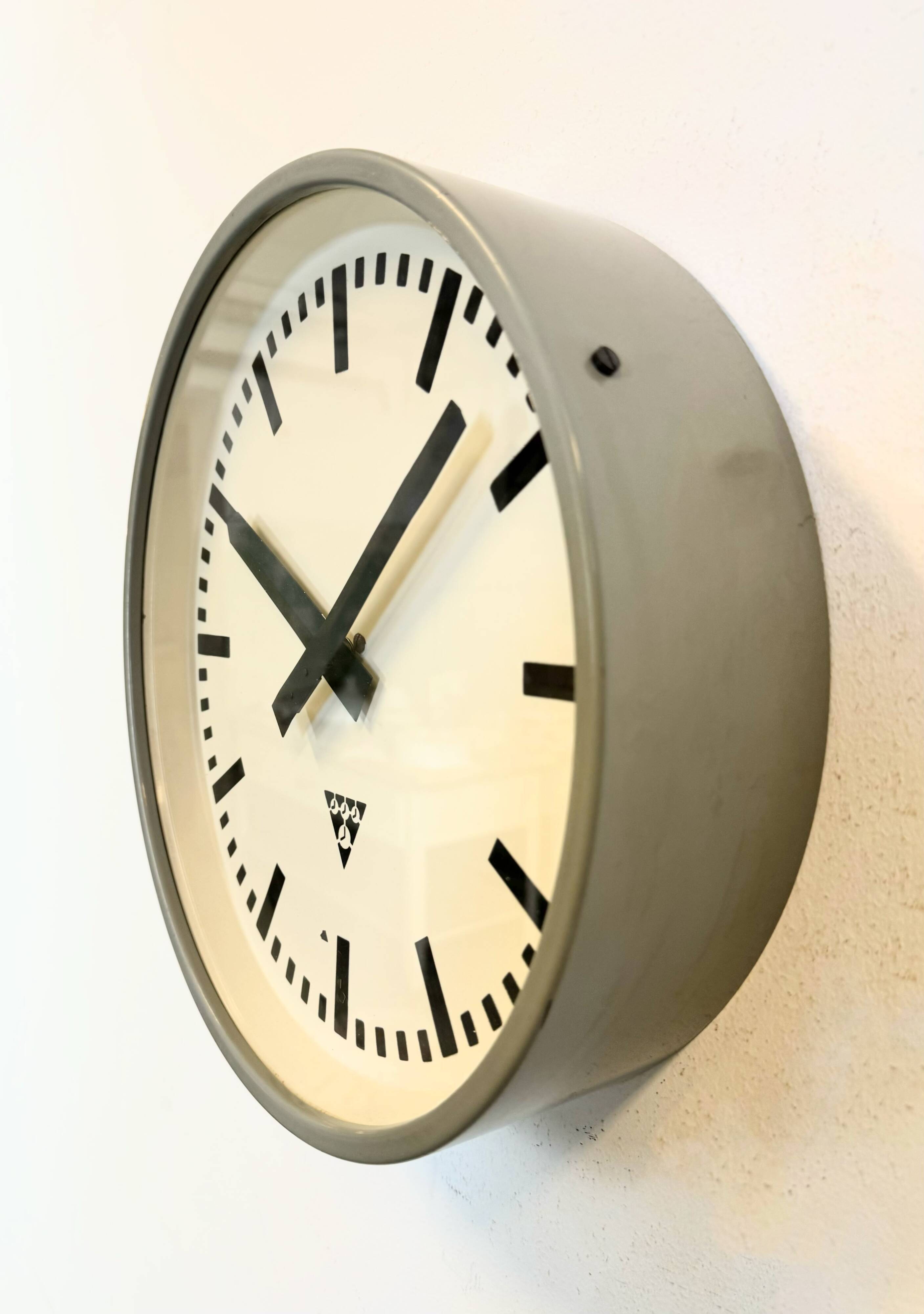 Industrial grey factory wall clock from pragotron, 1960s
