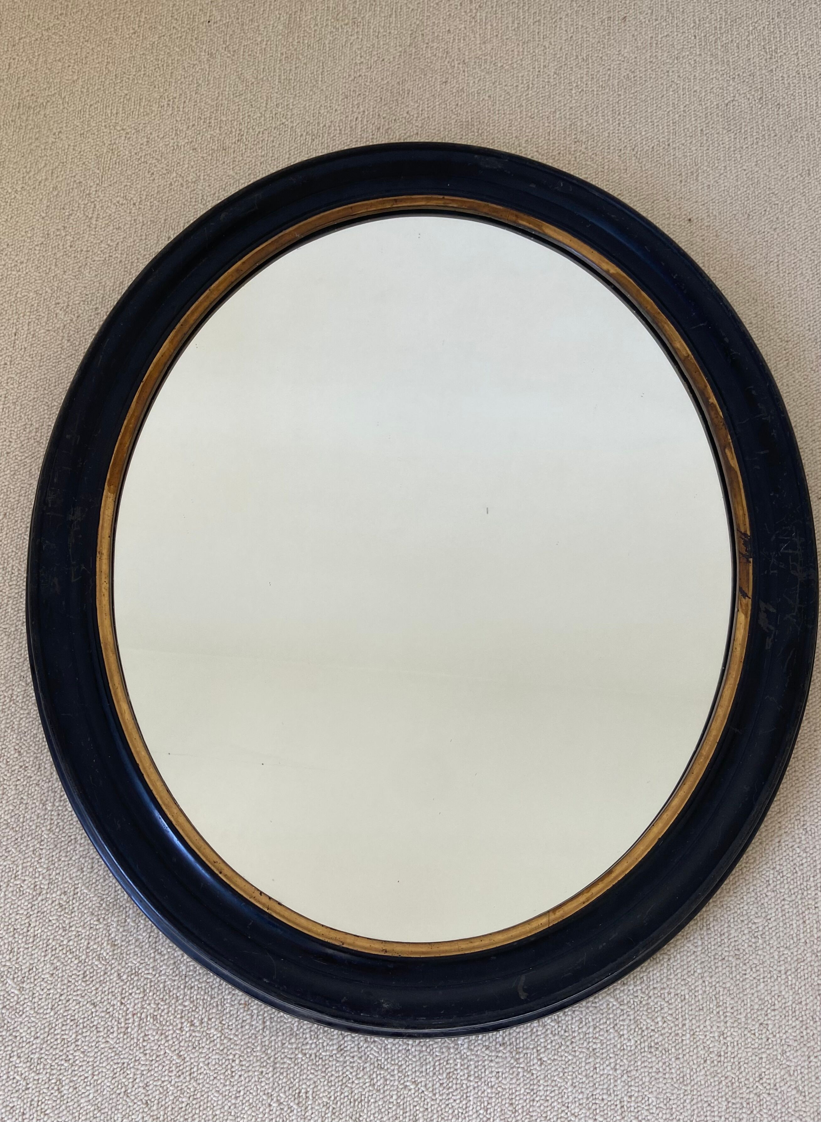 Black oval mirror, 19th century