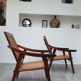 Pair of armchairs in red teak and cannage