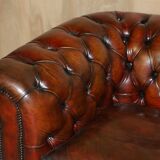 Pair of restored antique Chesterfield sofas in Boudreaux leather.