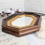 Antique mirror in black and gold octagonal wood