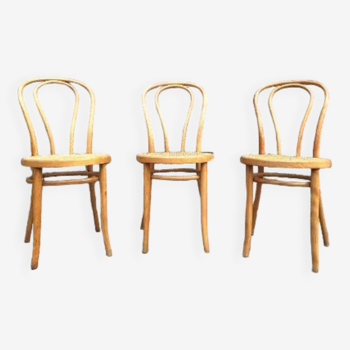 Trio of vintage chairs, cane bistro seats