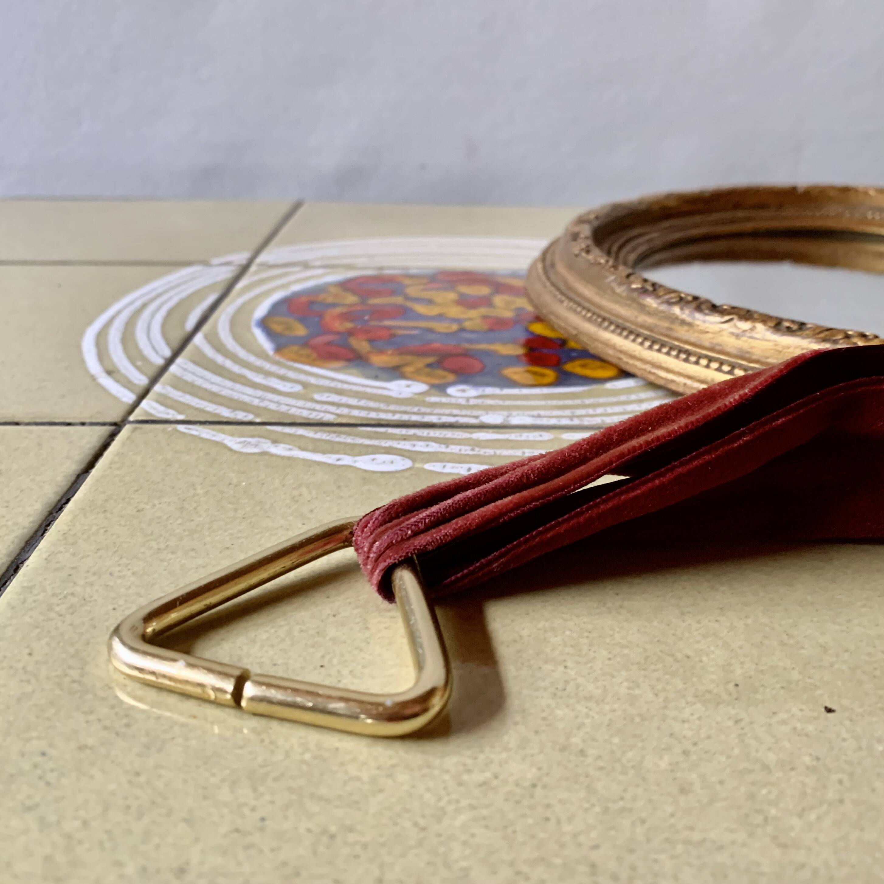 Small vintage wall mirror in gold painted wood