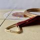 Small vintage wall mirror in gold painted wood