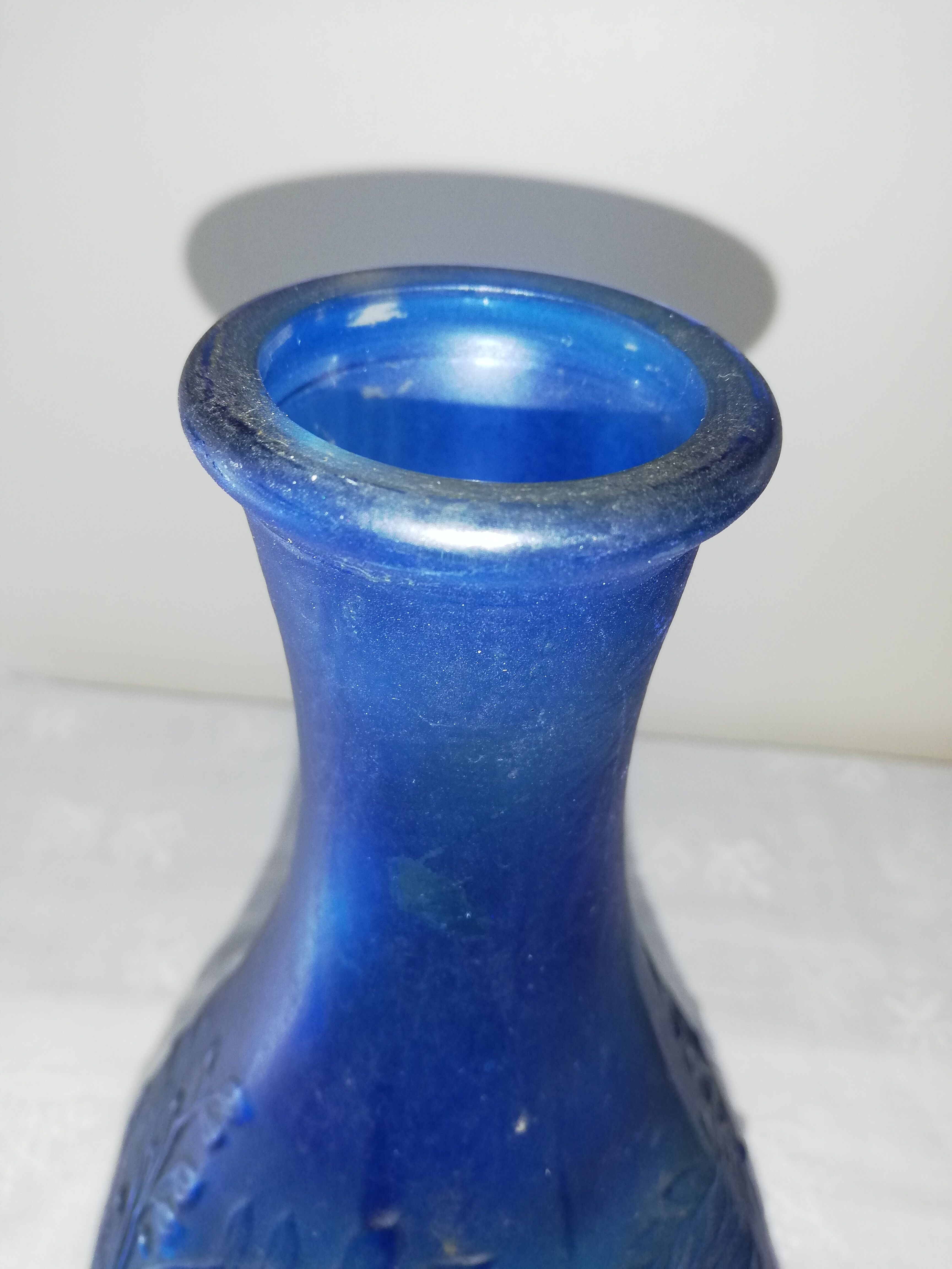 Blue glass bottle, engraved molded