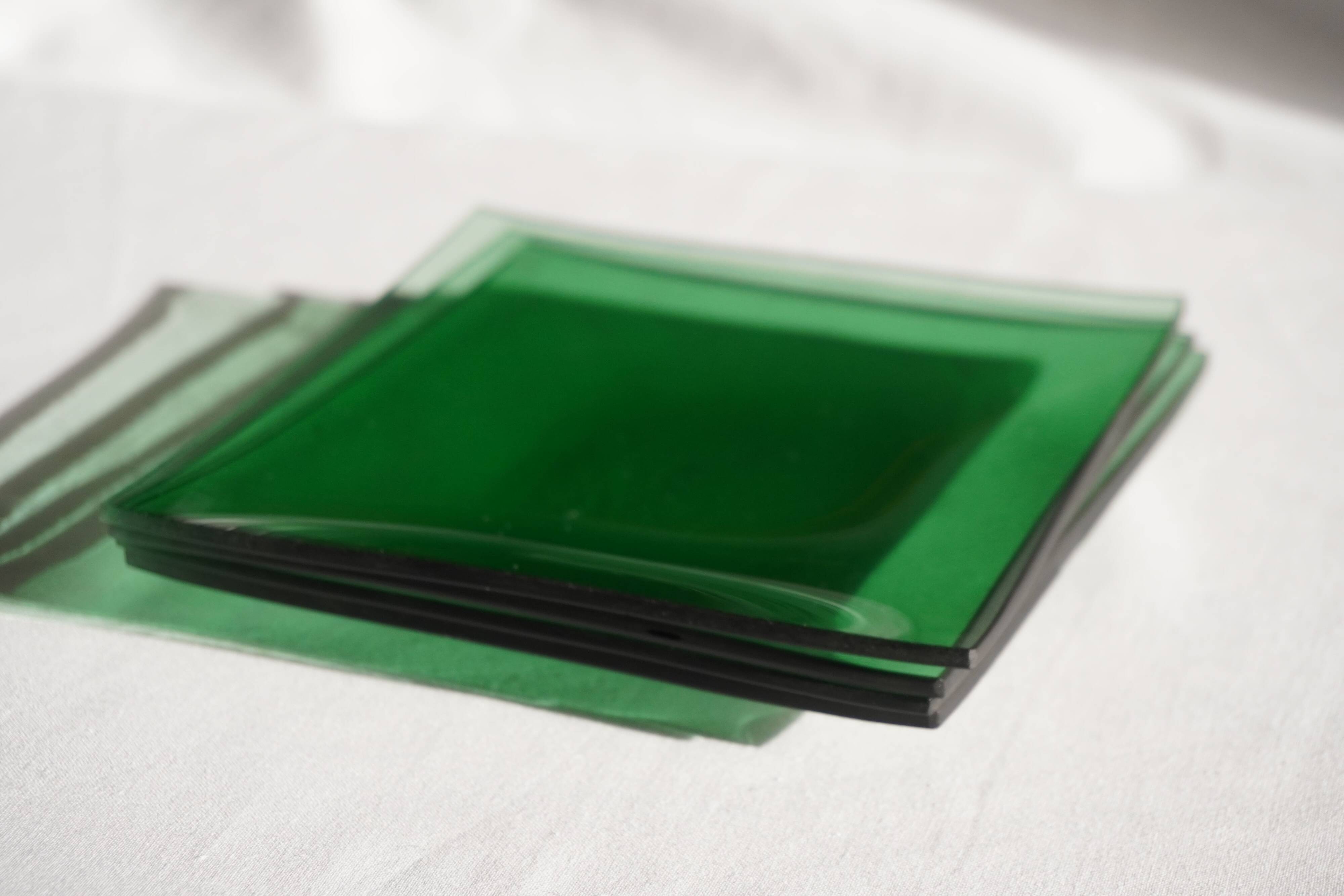 Set of 4 small square green glass plates/bowls