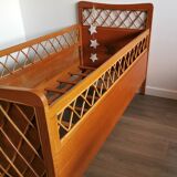 Rattan bed with compass feet