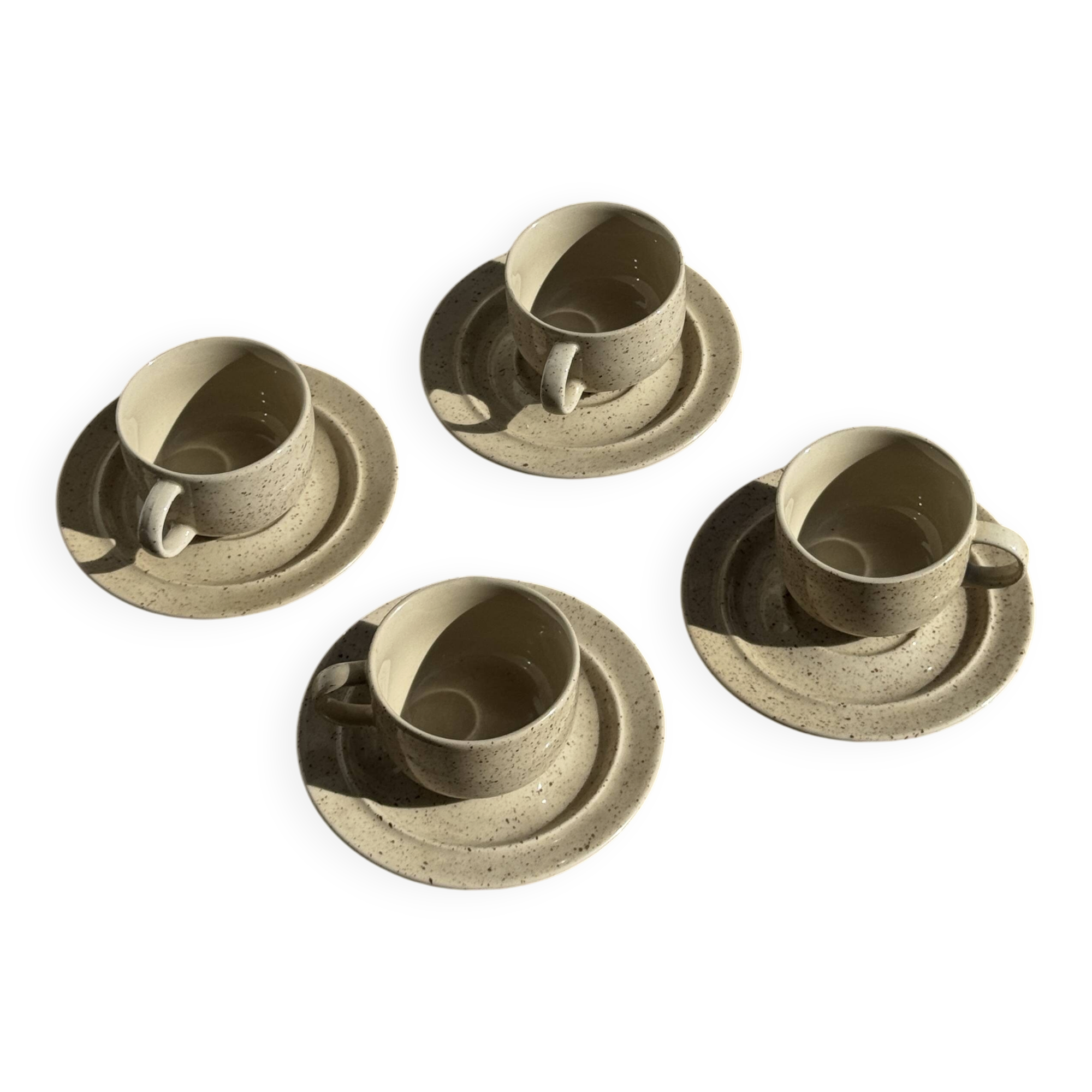 Set of 4 vintage speckled beige stoneware coffee cups.