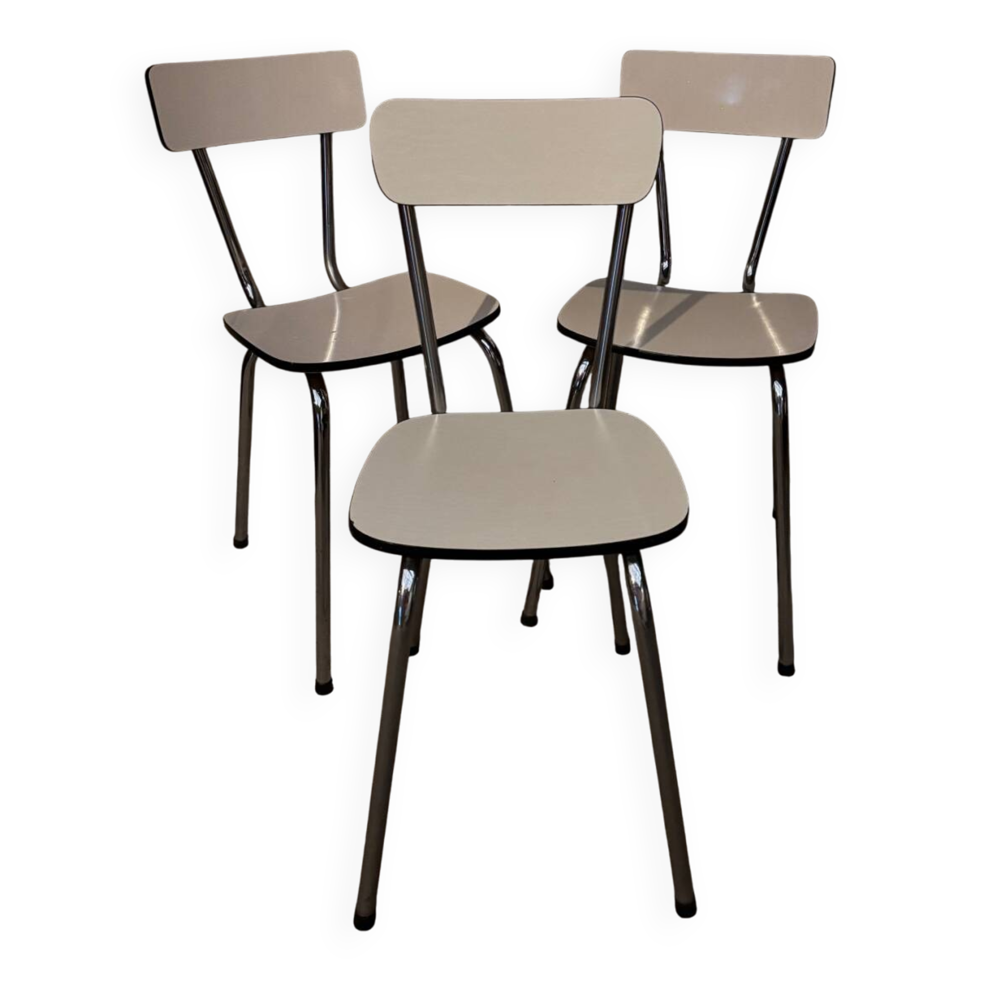 3 white Formica chairs